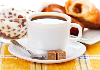 cup of coffee, fresh croissants and muesli