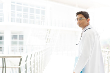 Naklejka na ściany i meble Asian Indian male medical doctor inside hospital.