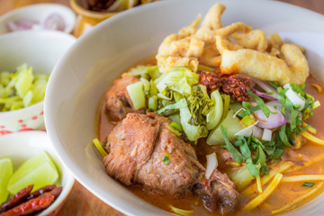 Noodle Khao soi , Thai food on wood background