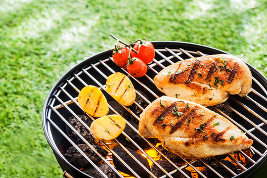 Lean healthy chicken breasts on a BBQ
