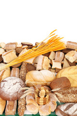 Bakery with wooden vase and ears of wheat.