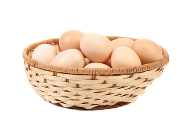 Wicker basket with eggs.