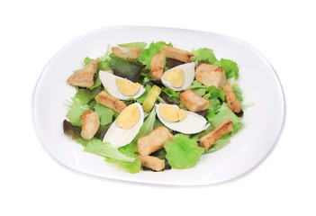 Close up of caesar salad with eggs.