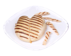 Chicken grilled fillet with slices on plate.