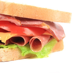 Sandwich with bacon and vegetables.