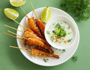 Fried prawns with sauce of yogurt and cucumber.
