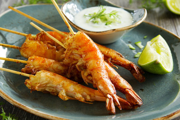 Fried prawns with sauce of yogurt and cucumber.