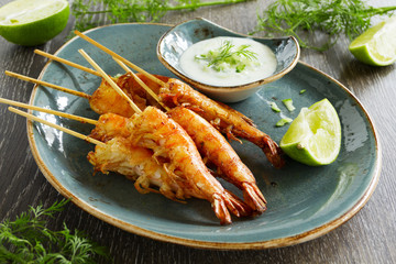 Fried prawns with sauce of yogurt and cucumber.