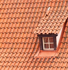 Tile roof with a window as a background