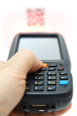 Obraz premium scanning QR code .label on the carton with laser isolated