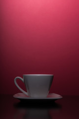 cup of coffee with red background