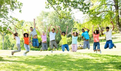 Cheerful friends jumping