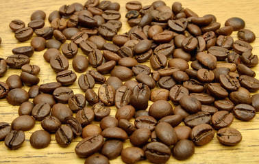Coffee beans on wood background