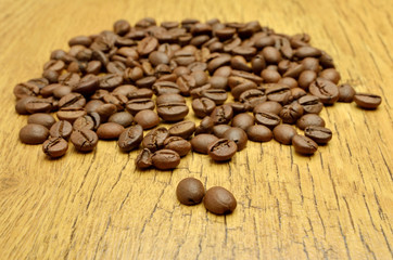 Coffee beans on wood background
