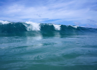 Ocean wave breaks from the water surface