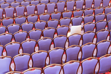 Rows of vacant seating in an auditorium
