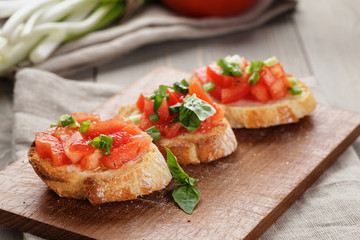 simple italian appetizing bruschetta with tomato - obrazy, fototapety, plakaty