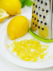 Lemon and lemon zest with grater