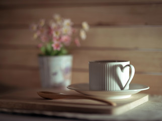 Cup of coffee with shadow of heart.