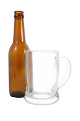 Side of bottle and glass on white background.