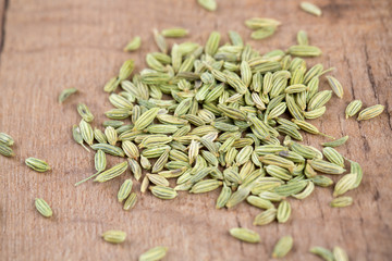 fennel seeds on wooden surface
