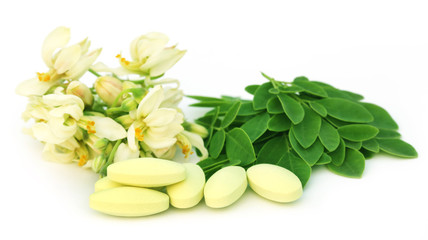 Moringa leaves and flower with pills