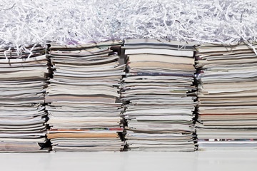 Stacked Magazines and Shredded Paper