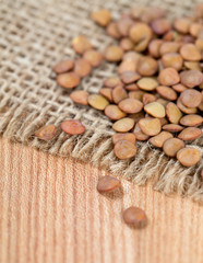 brown lentils on wooden table