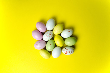 Easter eggs candy at yellow