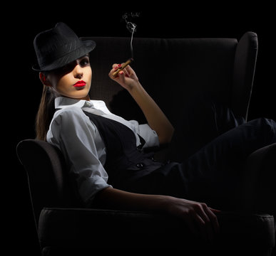 Young Woman With Cigar Sit On Chair