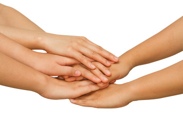  Hands on top of each other showing  unity with their hands toge