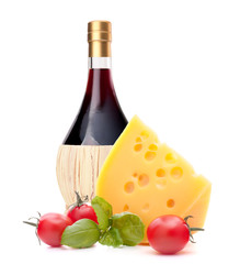 Red wine bottle, cheese and tomato still life