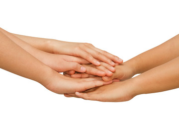 Hands on top of each other showing  unity with their hands toget