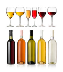 Set of white, rose, and red wine bottles and glass