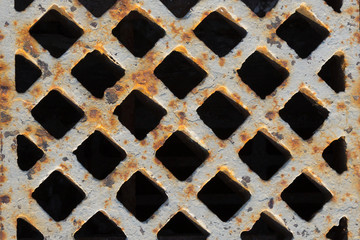 rusty grate in the sidewalk - 63146497