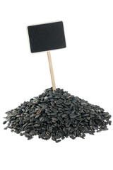Heap of sunflower  seeds with a pointer for your text