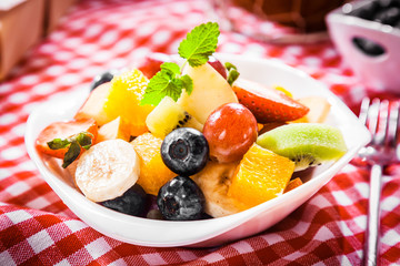 Colorful bowl of tropical fruit salad