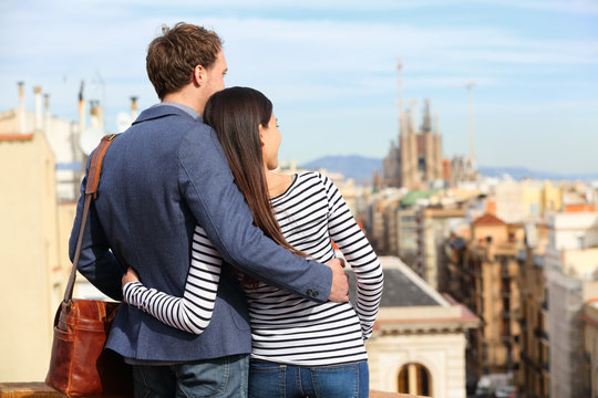 Romantic couple looking at view of Barcelona