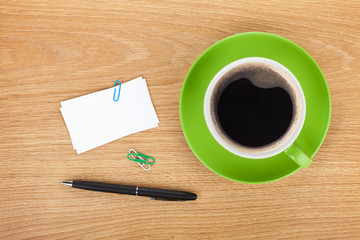Blank business cards over office table with supplies