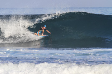 Surfer on Blue Ocean Wave.