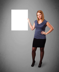 Young woman presenting white paper copy space