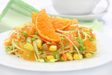 Salad with cabbage, carrots, mandarin and sweet corn