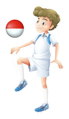 A male player using the ball with the flag of Monaco