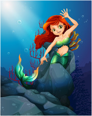 Obraz na płótnie Canvas A pretty mermaid trapped with the big rocks under the sea