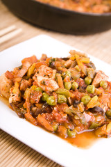 chinese food chicken with vegetables in tomato sauce