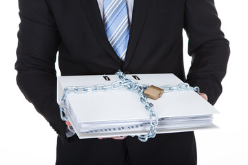 Businessman holding a top secret file