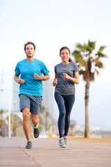 Obraz premium Running man and woman, Barcelona Beach Barceloneta