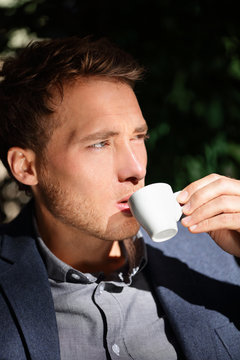 Handsome Man Portrait Drinking Espresso At Cafe