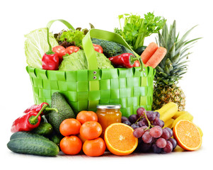 Green shopping bag with groceries isolated on white © monticellllo