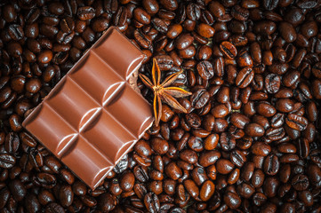 Star anise and chocolaete on coffe beans